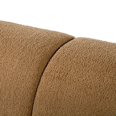 Boucle sofa with thick rounded arms and natural wooden legs, leg and base detail