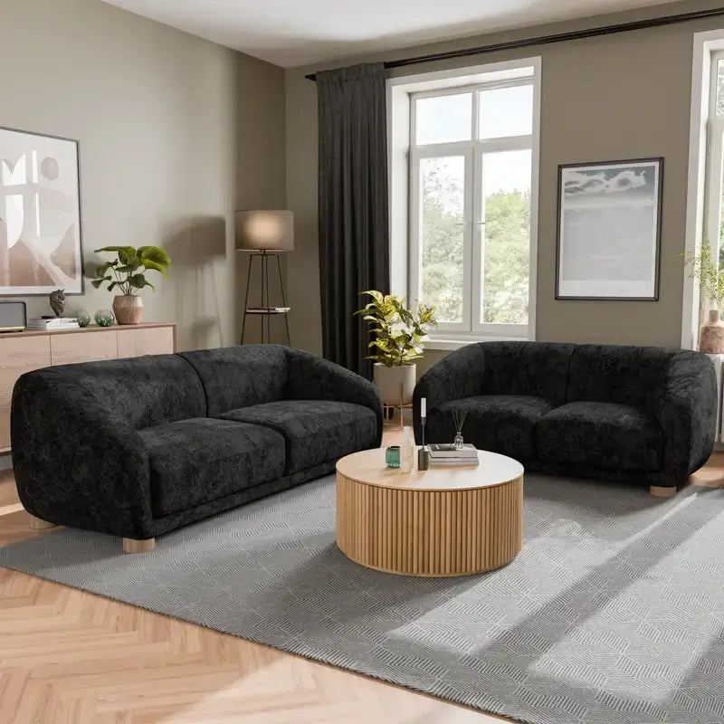 Fabric sofa with thick rounded arms and natural wooden legs, rear three-quarter view