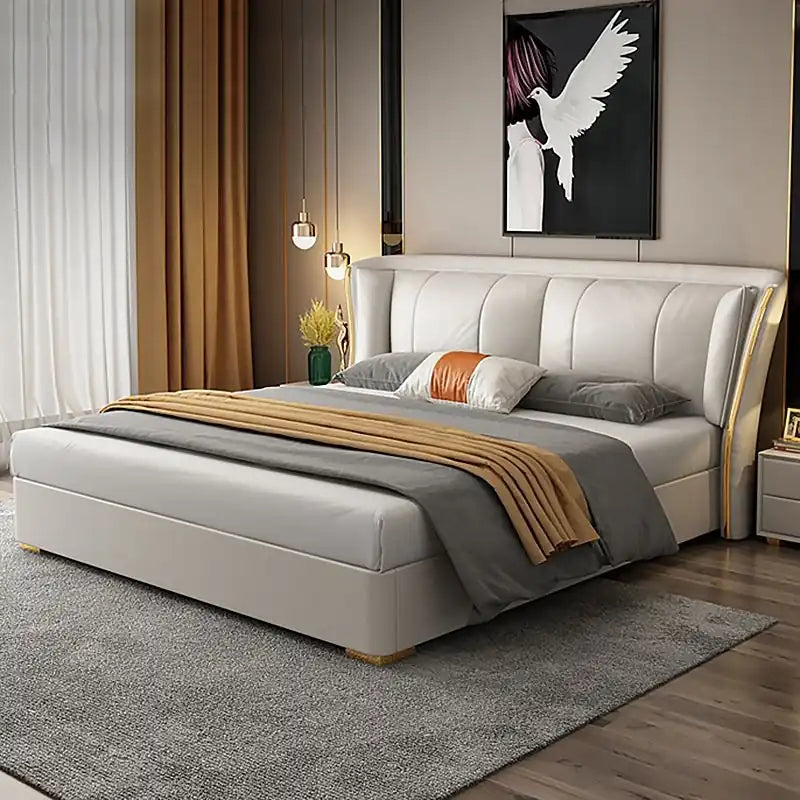 queen size upholstered bed shown in a spacious bed layout with wide padded headboard