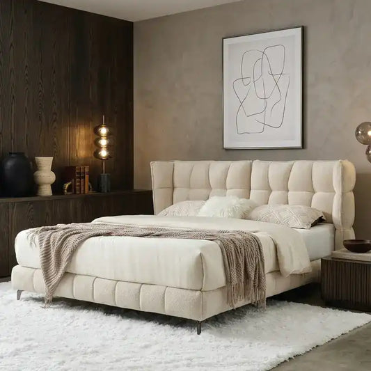 upholstered bed with storage shown in a spacious bed layout with thick padded headboard
