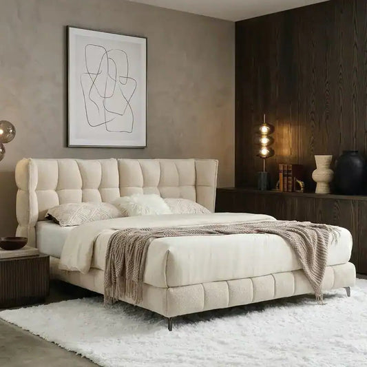 upholstered bed with storage shown in a spacious bed layout with thick padded headboard