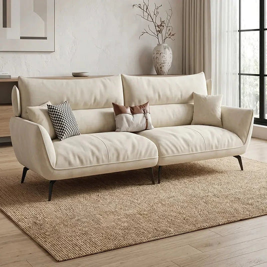 L shape sofa with soft curved arms and slim metal legs, front three-quarter view