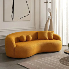 Luxury sofa with deep lounge seating and rounded arms, front three-quarter view