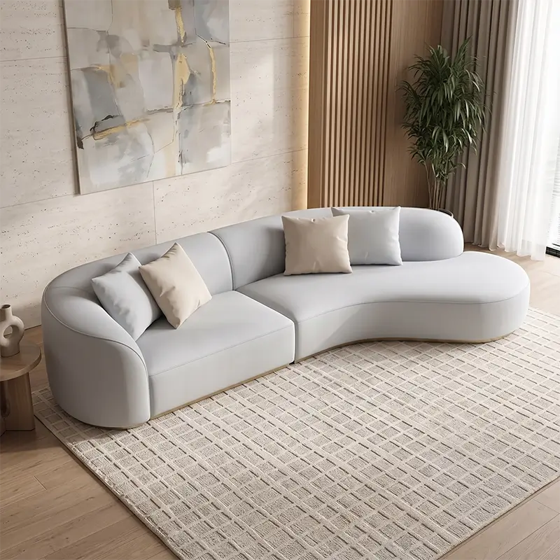 curved sofa with organic rounded silhouette and deep lounge cushioning, front perspective