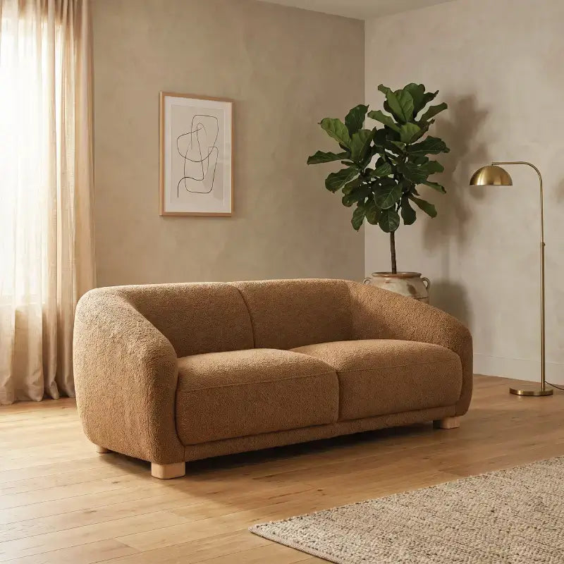 Fabric sofa with thick rounded arms and natural wooden legs, front three-quarter view