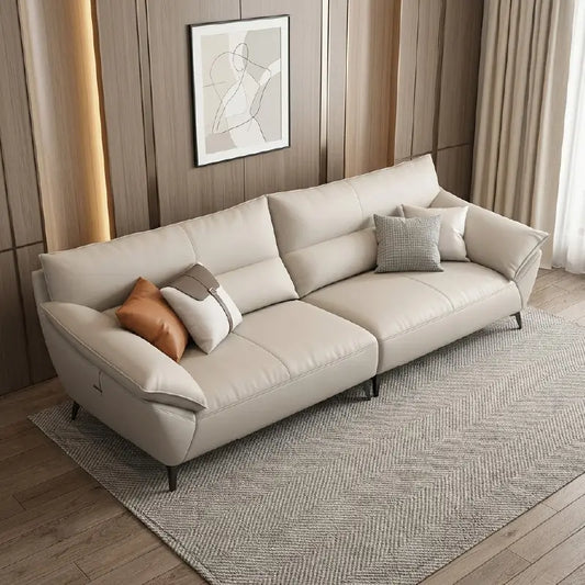 leatherette sofa with beige leatherette upholstery and stitched detailing, front perspective