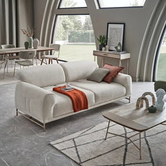 L shape sofa with rounded cushioned arms and metallic legs, close-up of seat cushions