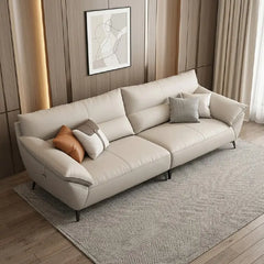 leatherette sofa with beige leatherette upholstery and stitched detailing, front perspective