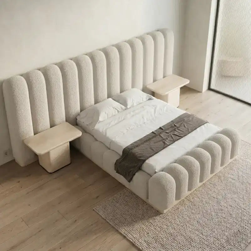luxury bed shown in a spacious bed layout with soft textured fabric