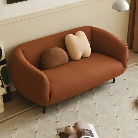Luxury sofa with wraparound backrest and compact seating, straight front view