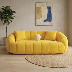 Channel-tufted cocoon form, fabric couch, modern sofa design, curved 3 seater yellow fabric