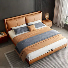 upholstered bed shown in a spacious bed layout with wide padded headboard