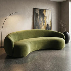 Curved sofa with wraparound backrest and deep bench seating, full seating layout