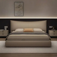 minimalist platform bed showing the lift-up storage area with curved padded headboard