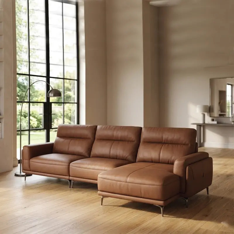 Leatherette sofa with wide padded arms and elevated metal legs, full seating layout