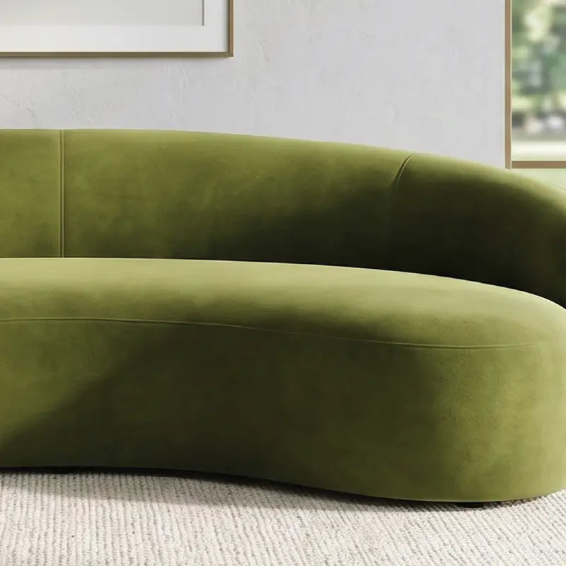 Curved sofa with wraparound backrest and deep bench seating, close-up of back cushions