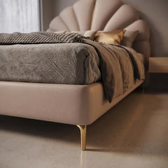 bed with headboard shown in a compact double-bed layout with shell-shaped padded headboard