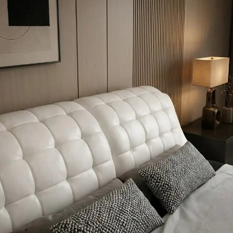 double bed with headboard showing the lift-up storage area with deep padded headboard