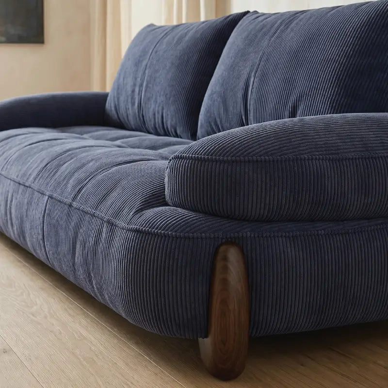 plush sofa with seat and back cushion close-up, upholstery close-up