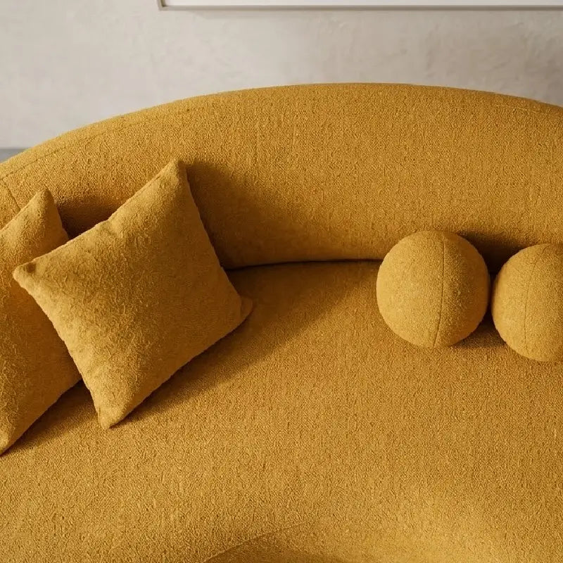 Lounge sofa with deep lounge seating and rounded arms, armrest detail