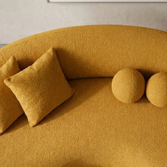 Lounge sofa with deep lounge seating and rounded arms, armrest detail