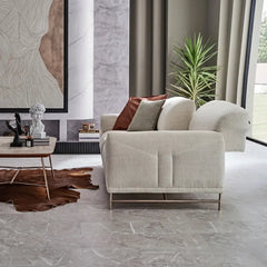 L shape sofa with rounded cushioned arms and metallic legs, armrest detail