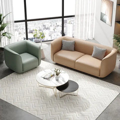 Curved sofa with soft rounded arms and low wraparound backrest, armrest detail