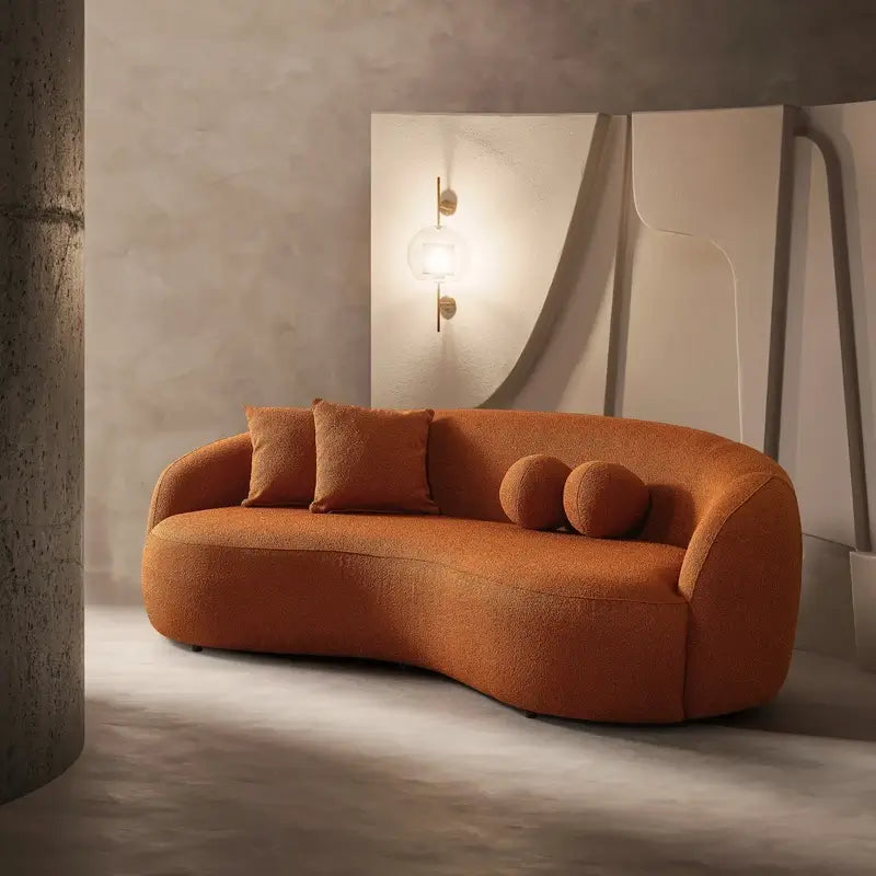 Lounge sofa with deep lounge seating and rounded arms, leg and base detail