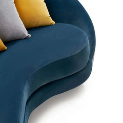 Luxury sofa set with curved backrest and gold-finish legs, wide-angle seating view