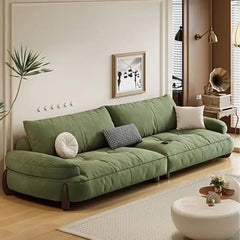 plush sofa with deep seating and loose cushion arrangement, cushion detail