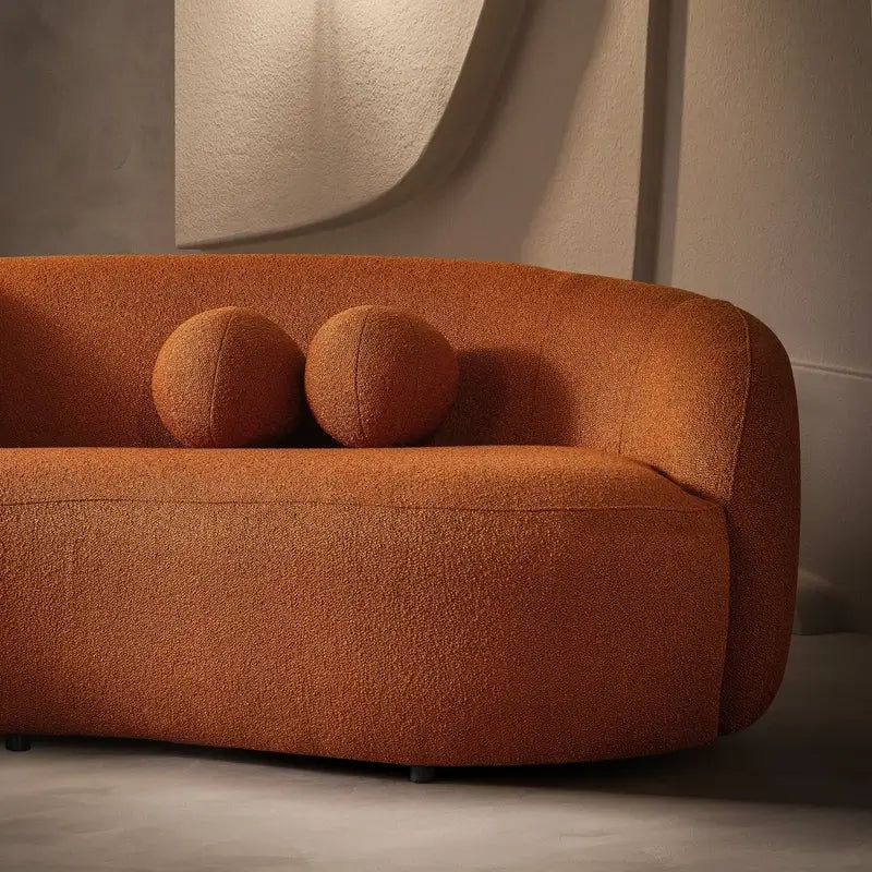 Luxury sofa with deep lounge seating and rounded arms, wide-angle seating view