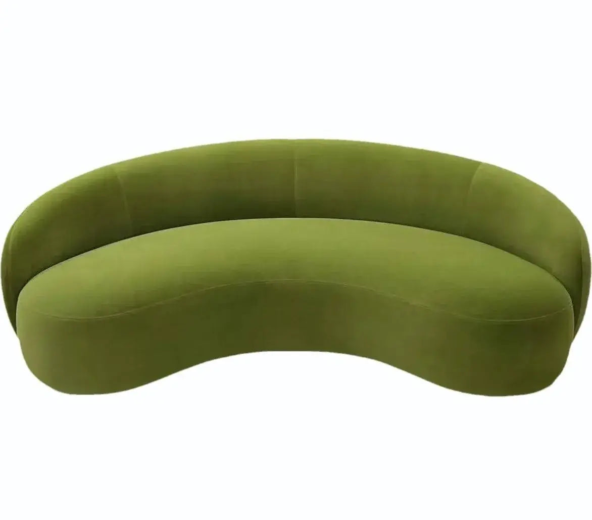 Curved sofa with wraparound backrest and deep bench seating, rear three-quarter view
