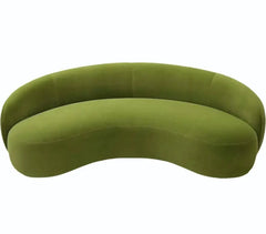 Curved sofa with wraparound backrest and deep bench seating, rear three-quarter view