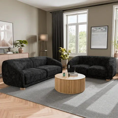 Fabric sofa with thick rounded arms and natural wooden legs, rear three-quarter view