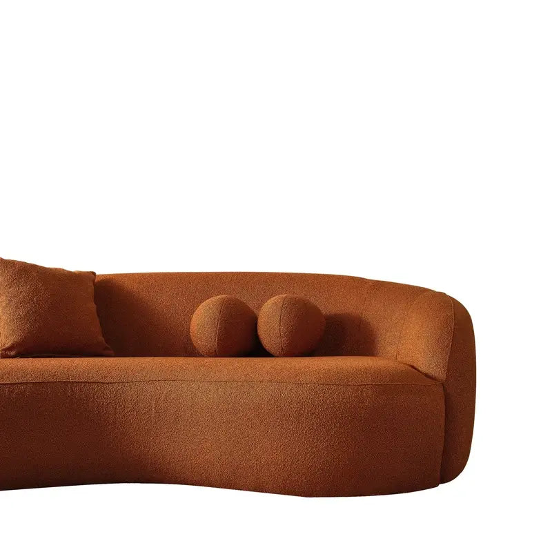 Luxury sofa with deep lounge seating and rounded arms, rear three-quarter view