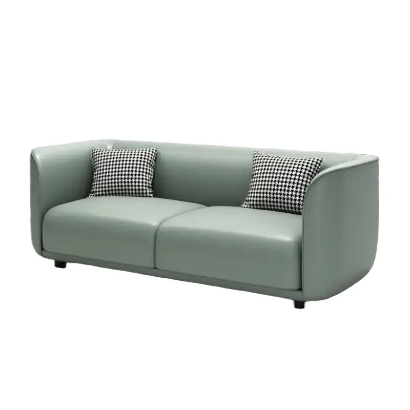 Lounge sofa with soft rounded arms and low wraparound backrest, rear three-quarter view