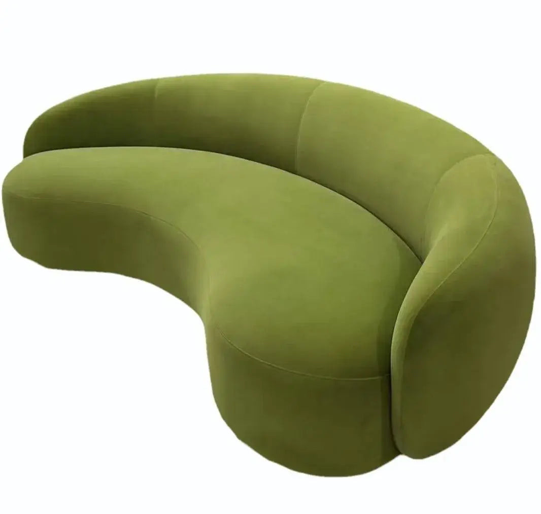 Curved sofa with wraparound backrest and deep bench seating, lounger configuration view