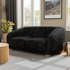 Fabric sofa with thick rounded arms and natural wooden legs, lounger configuration view