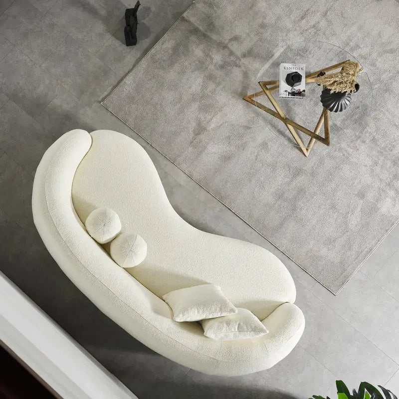 Luxury sofa with deep lounge seating and rounded arms, lounger configuration view