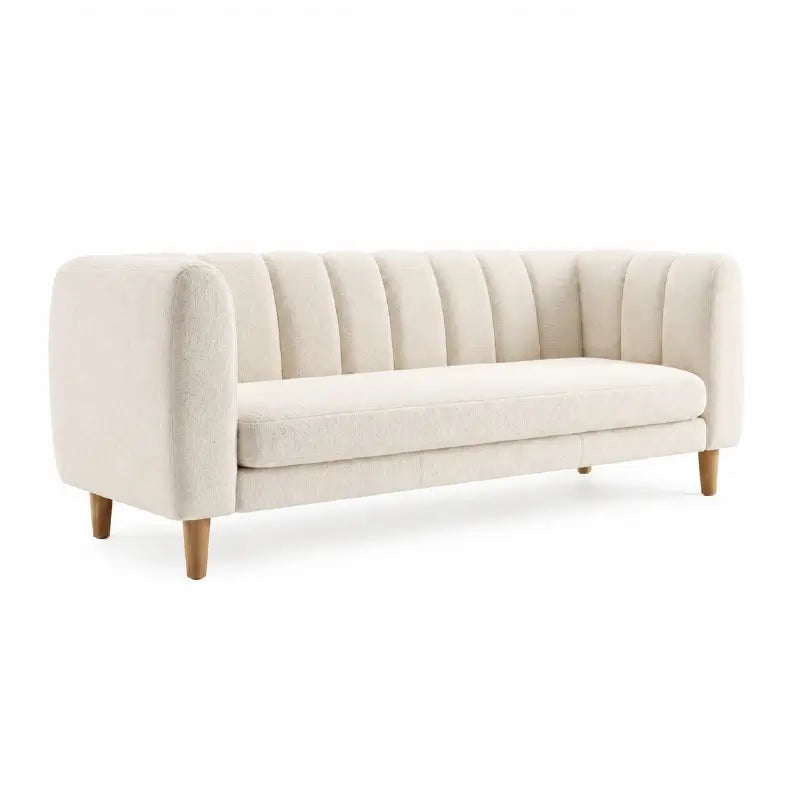 leatherette sofa with tapered wooden leg and floor clearance detail, cushion detail