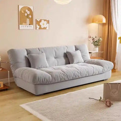 click clack sofa bed showing the sofa-to-bed conversion with fold-down padded backrest alternate front angle