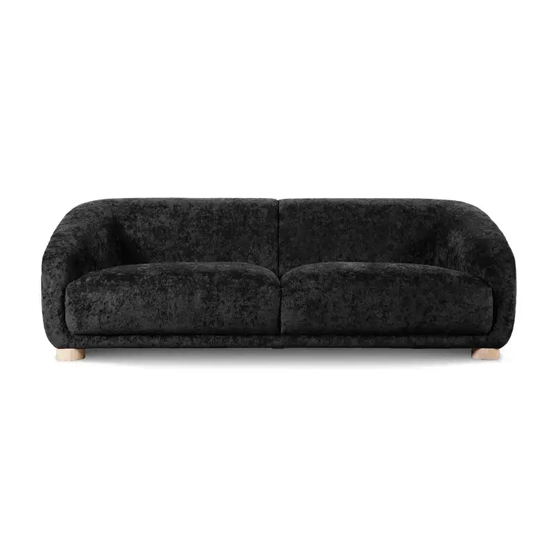 Fabric sofa with thick rounded arms and natural wooden legs, deep seating detail