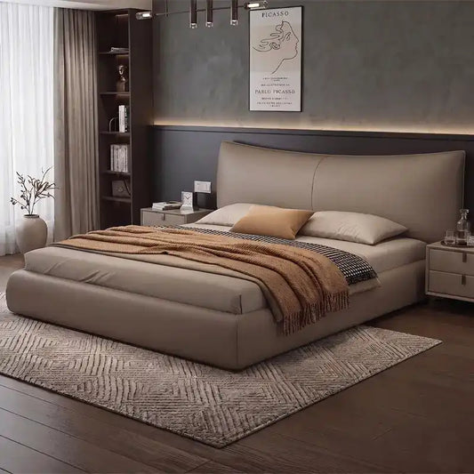 minimalist platform bed shown in a spacious bed layout with curved padded headboard