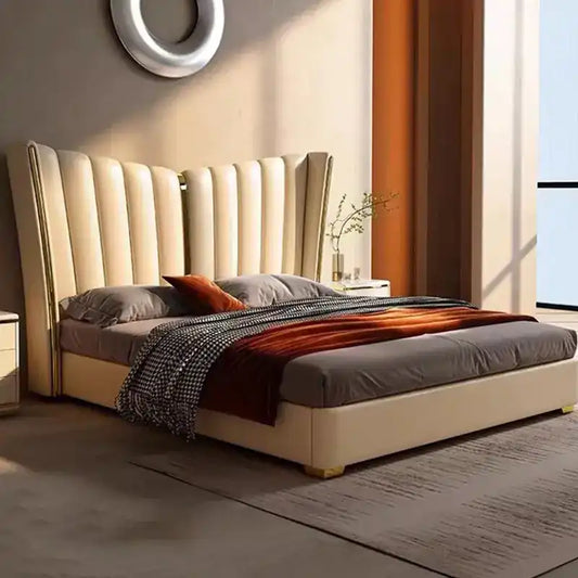 king size upholstered bed shown with a balanced mattress layout with wide padded headboard