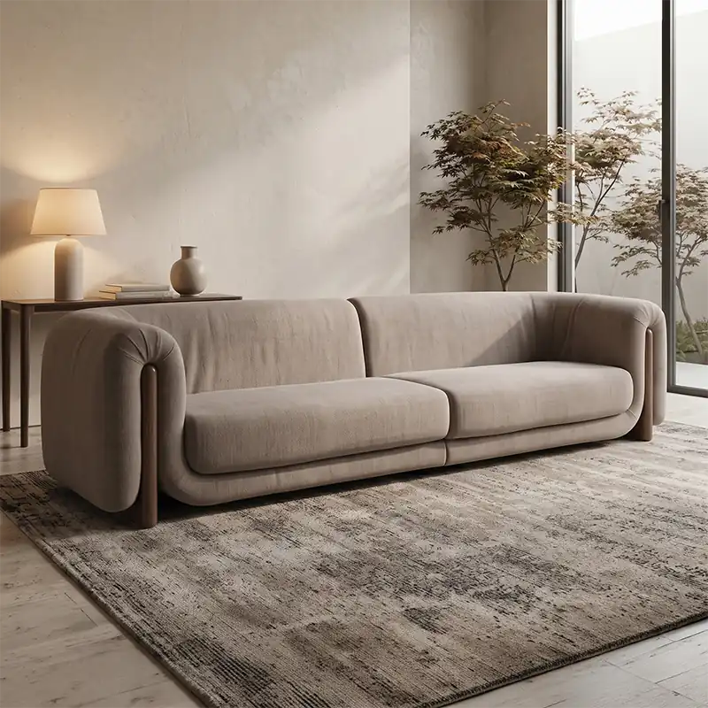 fabric sofa with rounded armrests and two broad seat cushions, front perspective