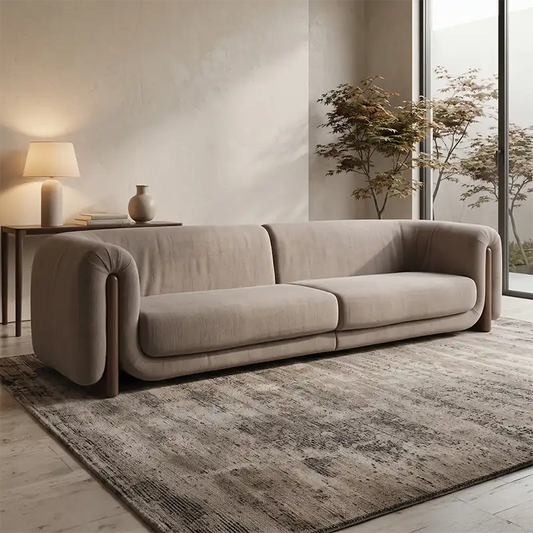 fabric sofa with rounded armrests and two broad seat cushions, front perspective