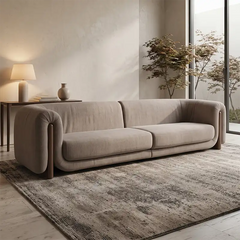 fabric sofa with rounded armrests and two broad seat cushions, front perspective