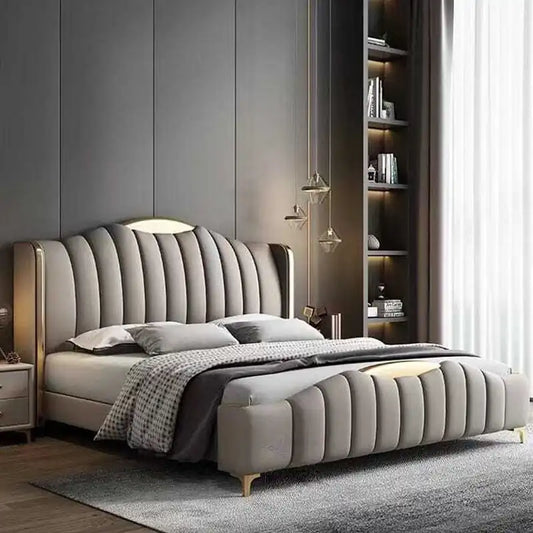 wingback bed shown with a balanced mattress layout with wide side-panel headboard