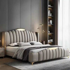wingback bed shown with a balanced mattress layout with wide side-panel headboard
