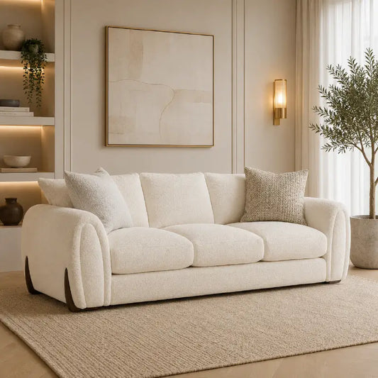 Corner sofa with curved arms and wooden accent details, front three-quarter view